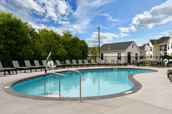 Sparkling outdoor pool with sundeck